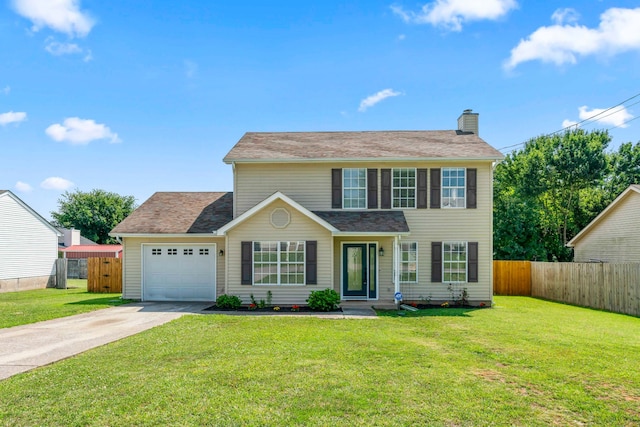 colonial home featuring a front lawn and a garage