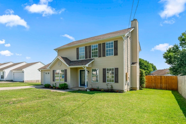 view of front of home featuring a front lawn and a garage