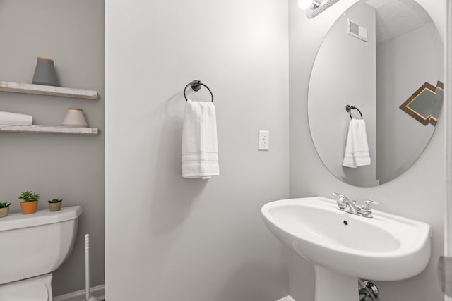 bathroom with toilet and sink