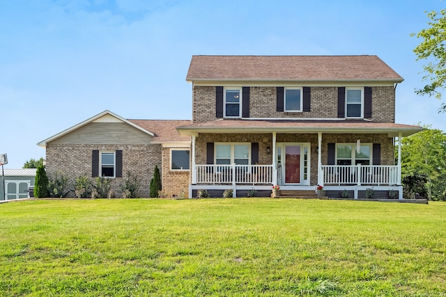 view of front of property featuring a front yard and covered porch