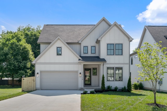 modern farmhouse style home featuring a front yard and a garage