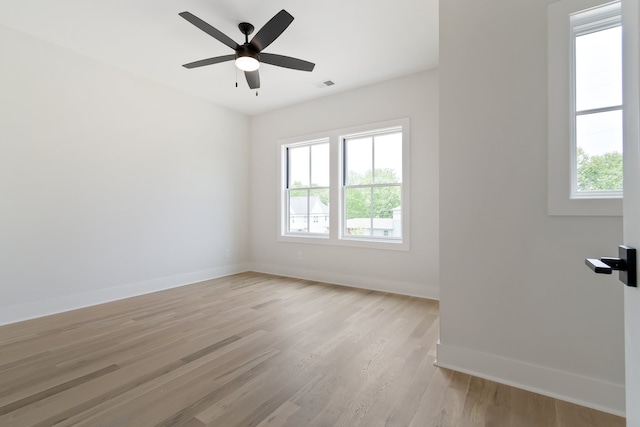 spare room with ceiling fan and light hardwood / wood-style flooring