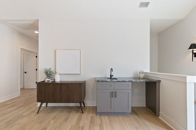 interior space with light hardwood / wood-style floors and sink