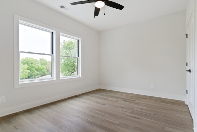 empty room featuring light hardwood / wood-style flooring and ceiling fan