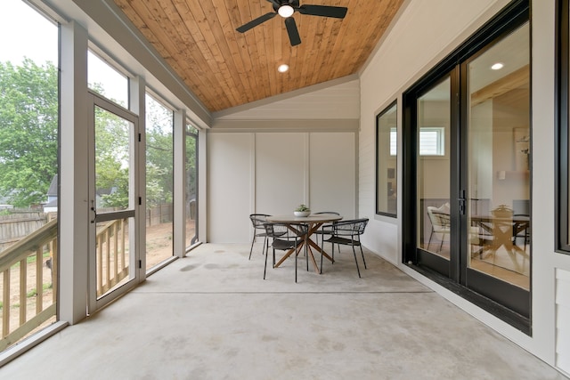 sunroom with wooden ceiling, ceiling fan, and a healthy amount of sunlight