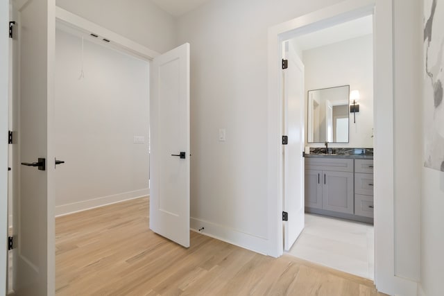 hall with light hardwood / wood-style flooring