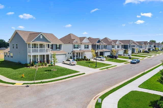 view of property featuring a front lawn and a garage