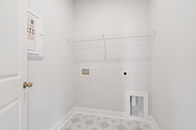 laundry room with hookup for an electric dryer, washer hookup, and light tile floors