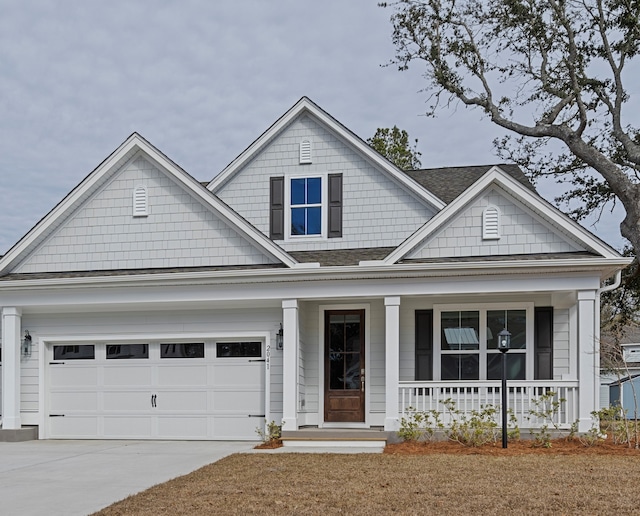 view of front facade featuring a porch and a garage