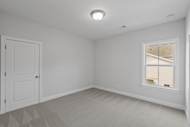 carpeted empty room featuring a healthy amount of sunlight