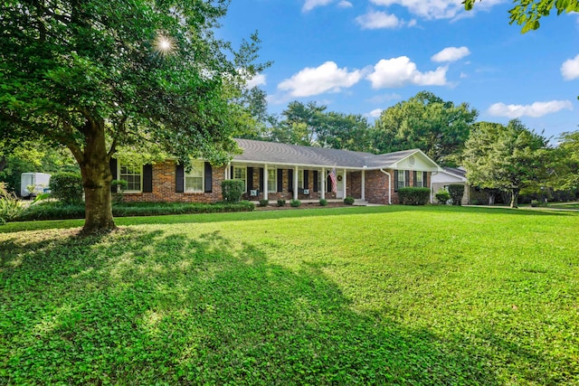 ranch-style home featuring a front yard