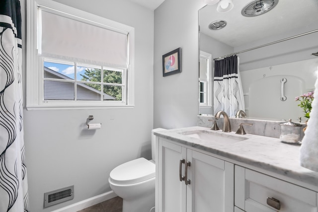 bathroom featuring toilet and oversized vanity