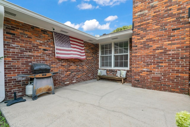 view of patio with a grill