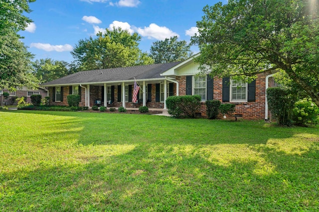 ranch-style home featuring a front yard