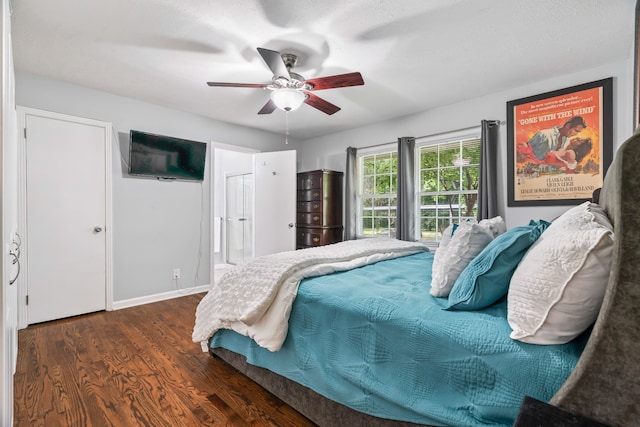 bedroom featuring dark hardwood / wood-style flooring and ceiling fan