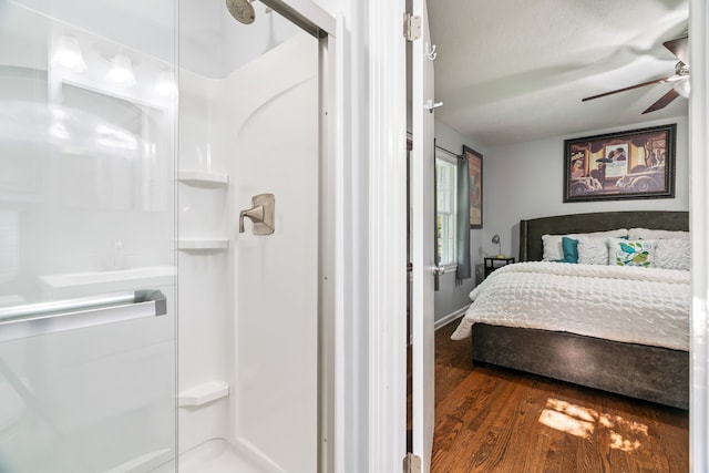 bedroom featuring dark hardwood / wood-style flooring and ceiling fan