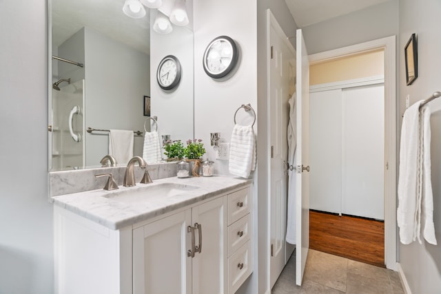 bathroom with vanity and hardwood / wood-style flooring