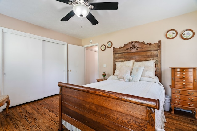 bedroom featuring a closet, dark hardwood / wood-style floors, and ceiling fan