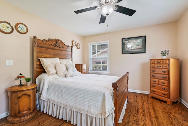 bedroom featuring ceiling fan and dark hardwood / wood-style floors