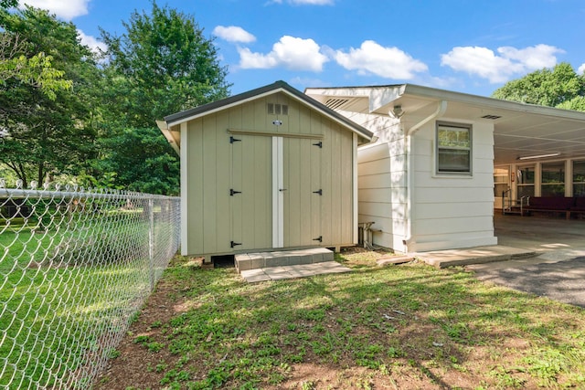 view of shed / structure featuring a yard