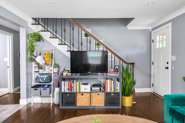 living room with crown molding and dark hardwood / wood-style flooring