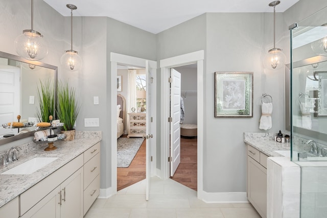 bathroom with tile floors and vanity with extensive cabinet space