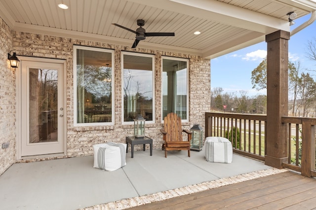 wooden deck featuring ceiling fan