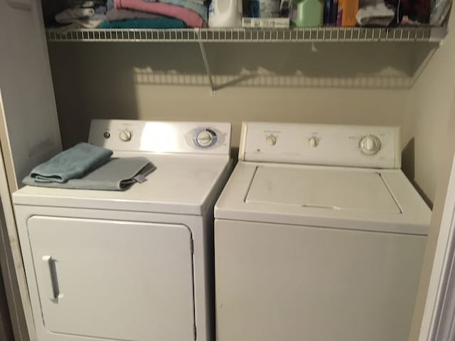 washroom with washer and dryer