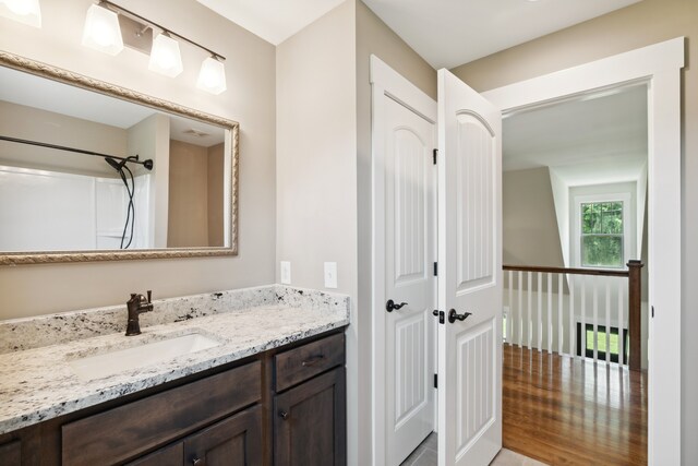 bathroom featuring hardwood / wood-style floors and vanity