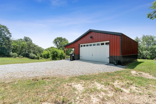 garage featuring a lawn