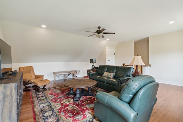 living room with ceiling fan and light wood-type flooring