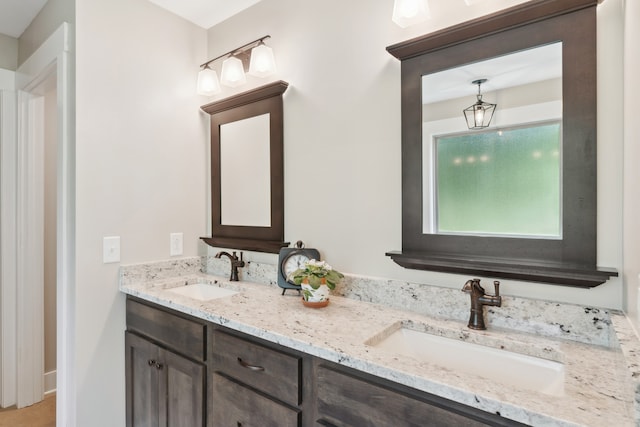 bathroom with dual bowl vanity