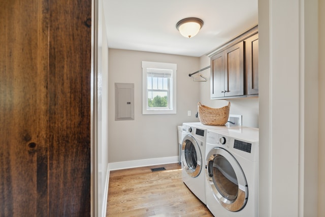 laundry area with cabinets, light wood-type flooring, separate washer and dryer, and hookup for a washing machine