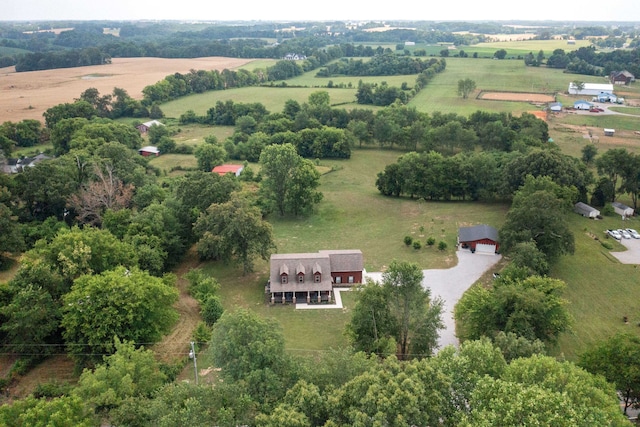 birds eye view of property with a rural view