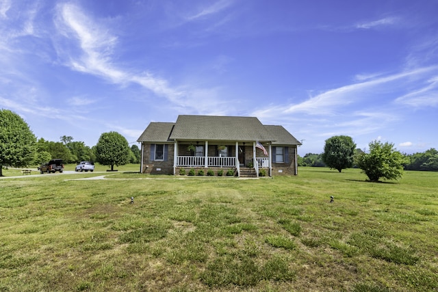 view of front facade with covered porch and a front yard