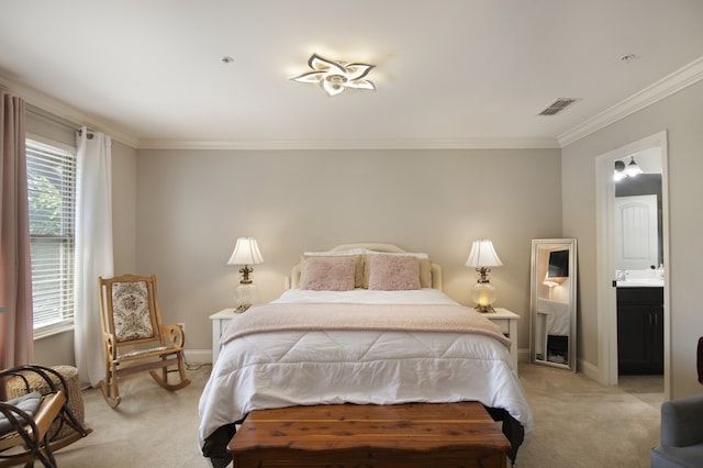 carpeted bedroom featuring crown molding and ensuite bathroom