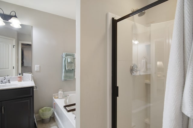 bathroom with plus walk in shower and vanity with extensive cabinet space