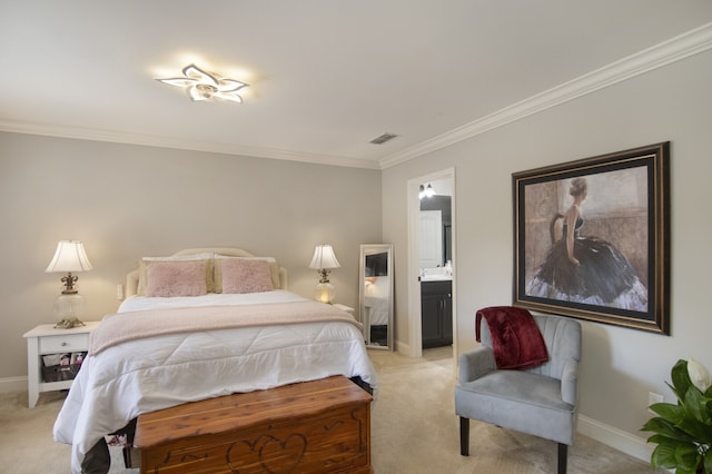 bedroom with crown molding, light colored carpet, and ensuite bath