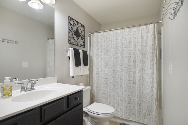 bathroom with toilet and oversized vanity