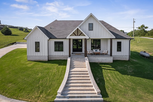 modern farmhouse featuring a front lawn