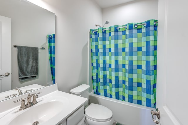 full bathroom featuring toilet, shower / bath combo, and vanity