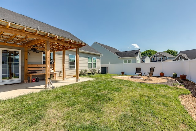 view of yard featuring a pergola, central AC unit, ceiling fan, and a patio