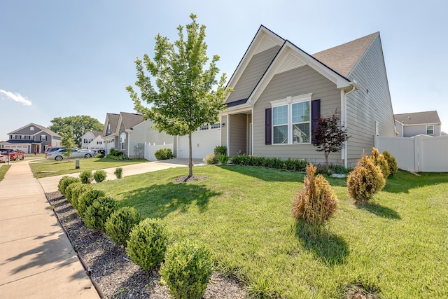 view of front of house featuring a front yard and a garage