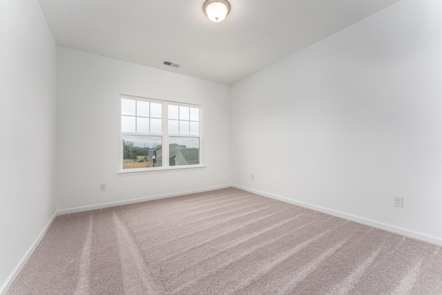 empty room featuring light colored carpet