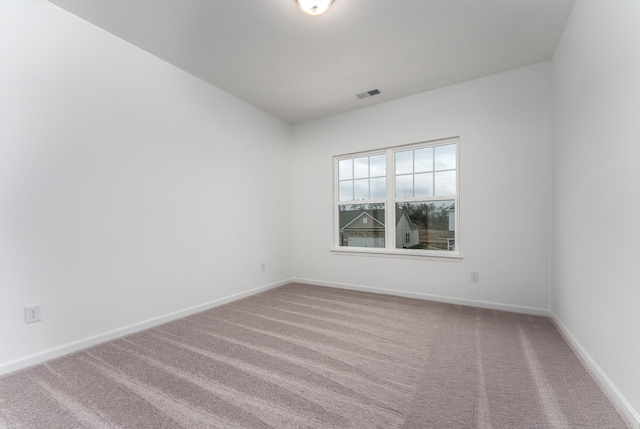 spare room with carpet floors