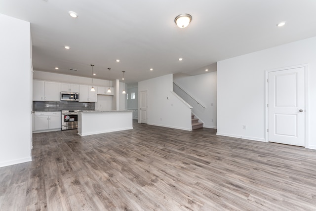 unfurnished living room featuring light hardwood / wood-style flooring