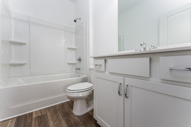 full bathroom with toilet, tub / shower combination, vanity, and hardwood / wood-style floors