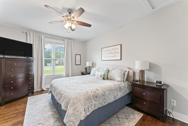 bedroom with hardwood / wood-style floors and ceiling fan