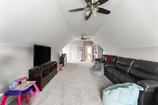 living room with ceiling fan, lofted ceiling, and light carpet