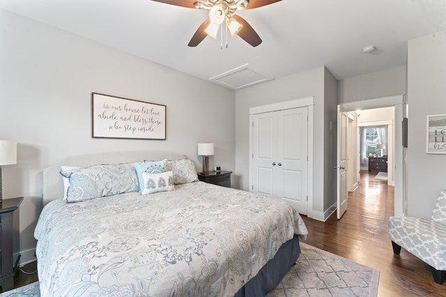 bedroom featuring dark hardwood / wood-style flooring, a closet, and ceiling fan